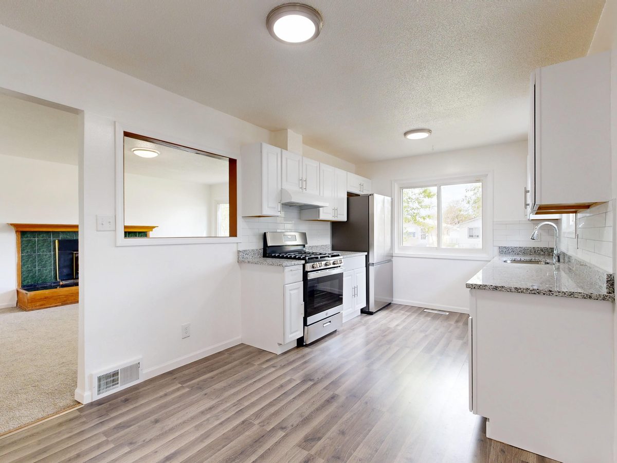 Remodeled kitchen with granite countertops and stainless steel appliances