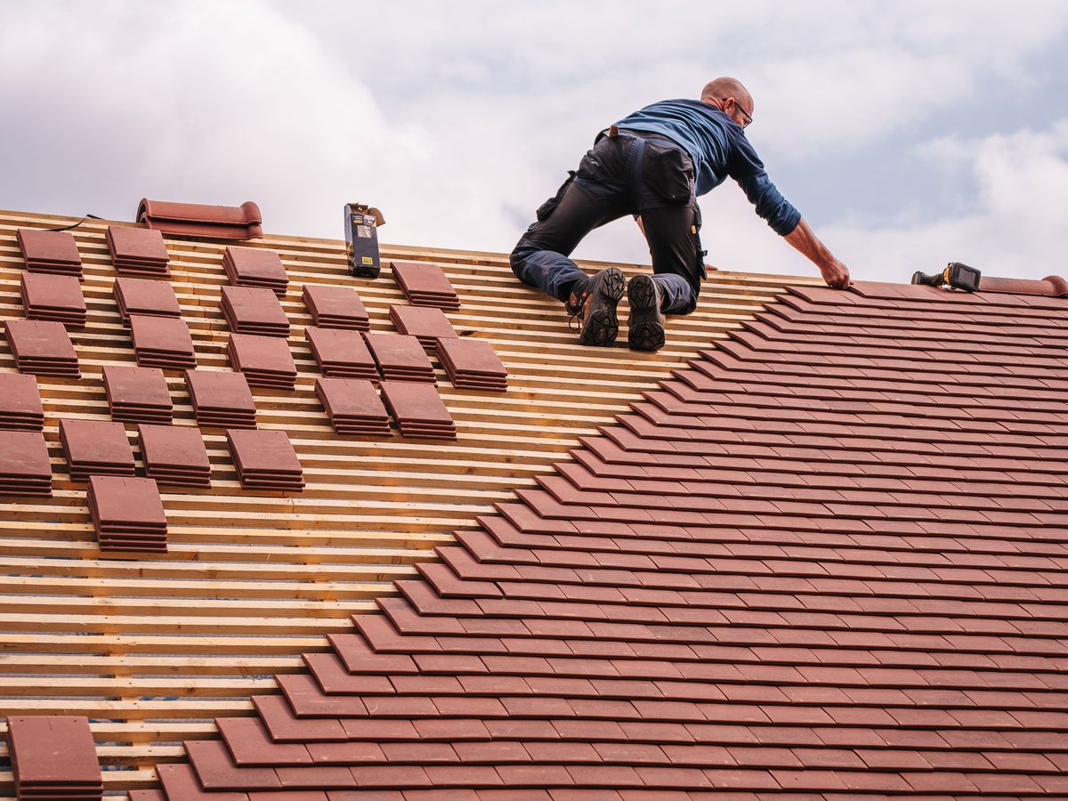 New roof installation with clay tile roofing